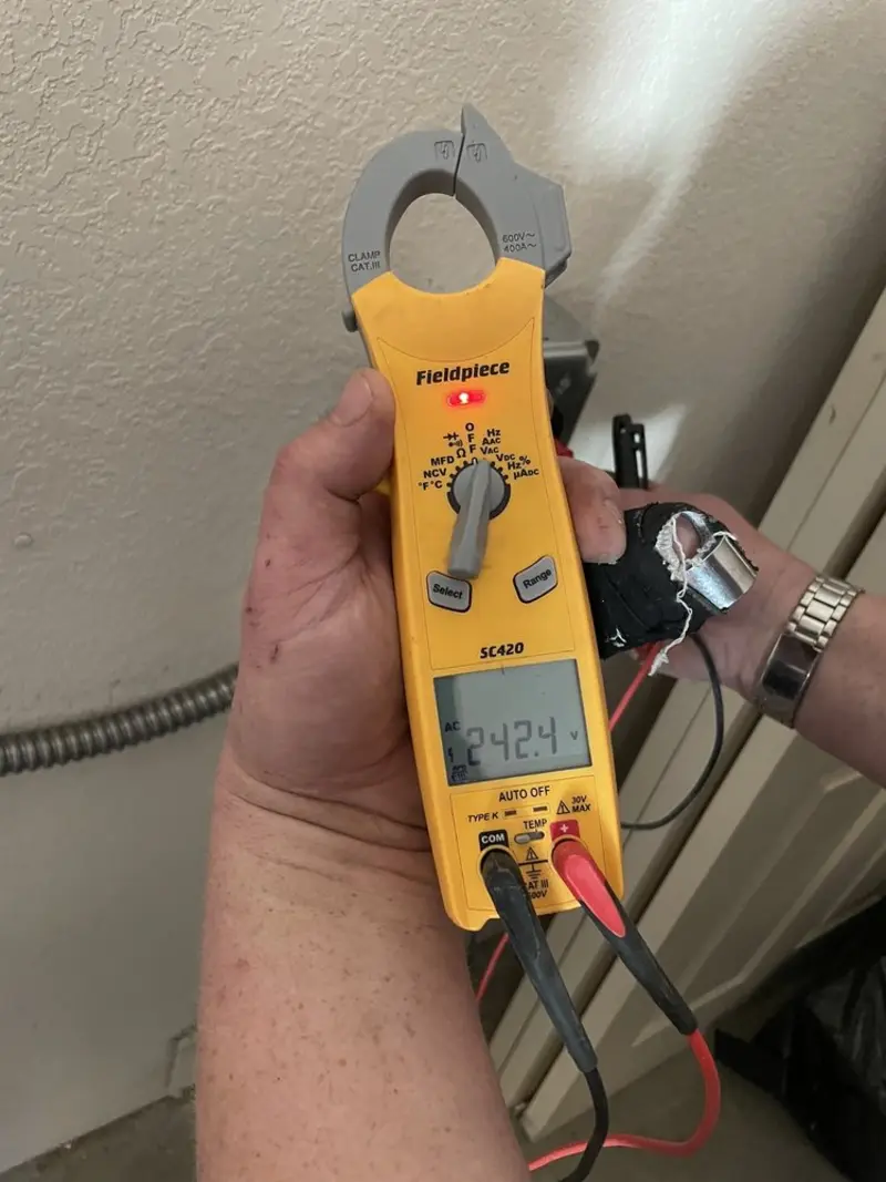 Voltage testing with clamp meter during Ceiling Fan Installation in Stonington